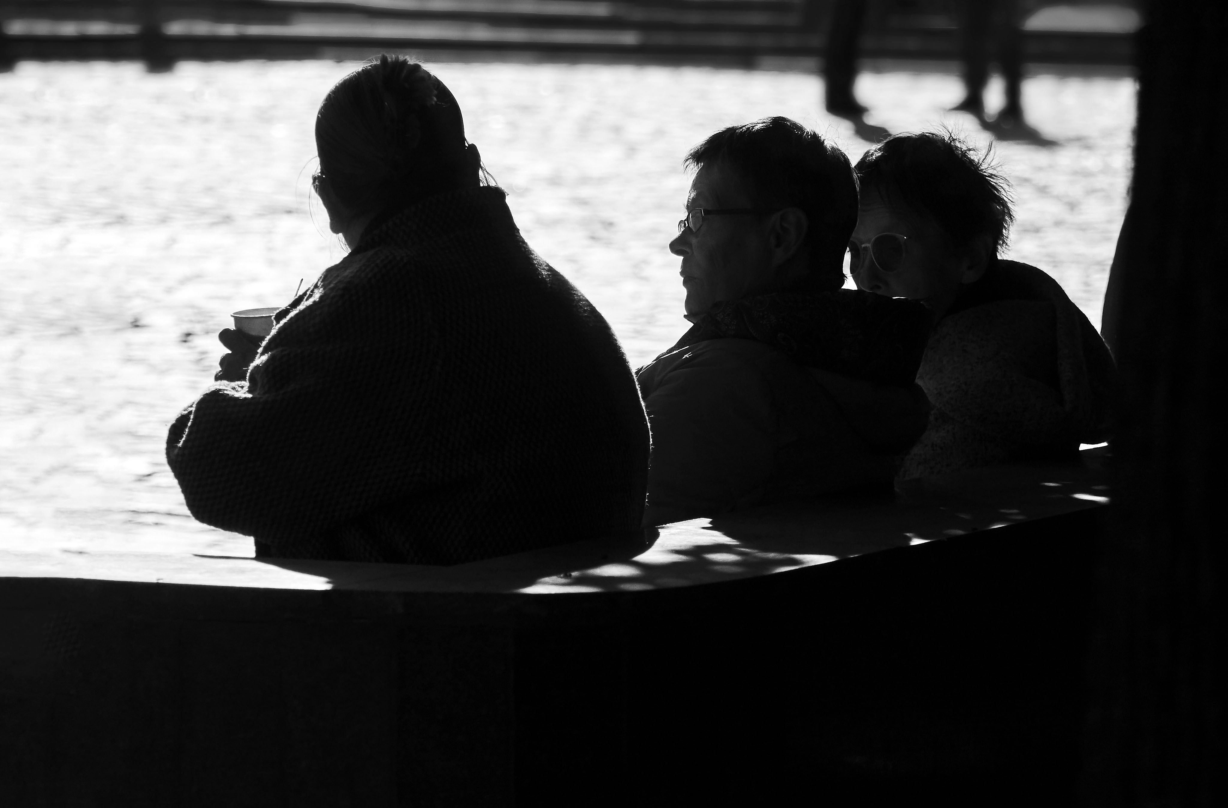A group of women enjoying autumn sun, their cappucinons, and discussing something important :)